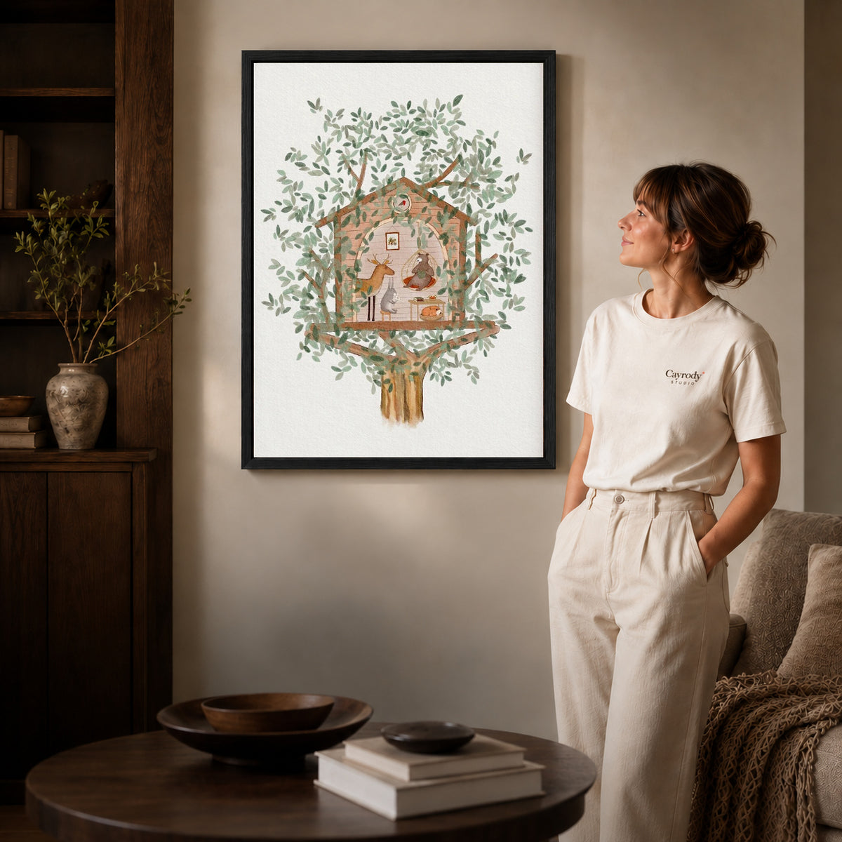 Woodland treehouse canvas art shown in the black frame option against a softly lit wall.