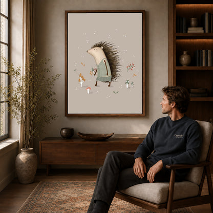 Hedgehog sweater canvas art in a walnut frame above a console beside a seated man.