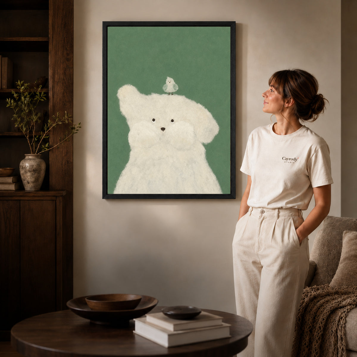 Puppy and bird canvas art shown in the black frame option against a softly lit wall.