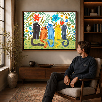 Garden cats canvas art in a walnut frame above a console beside a seated man.