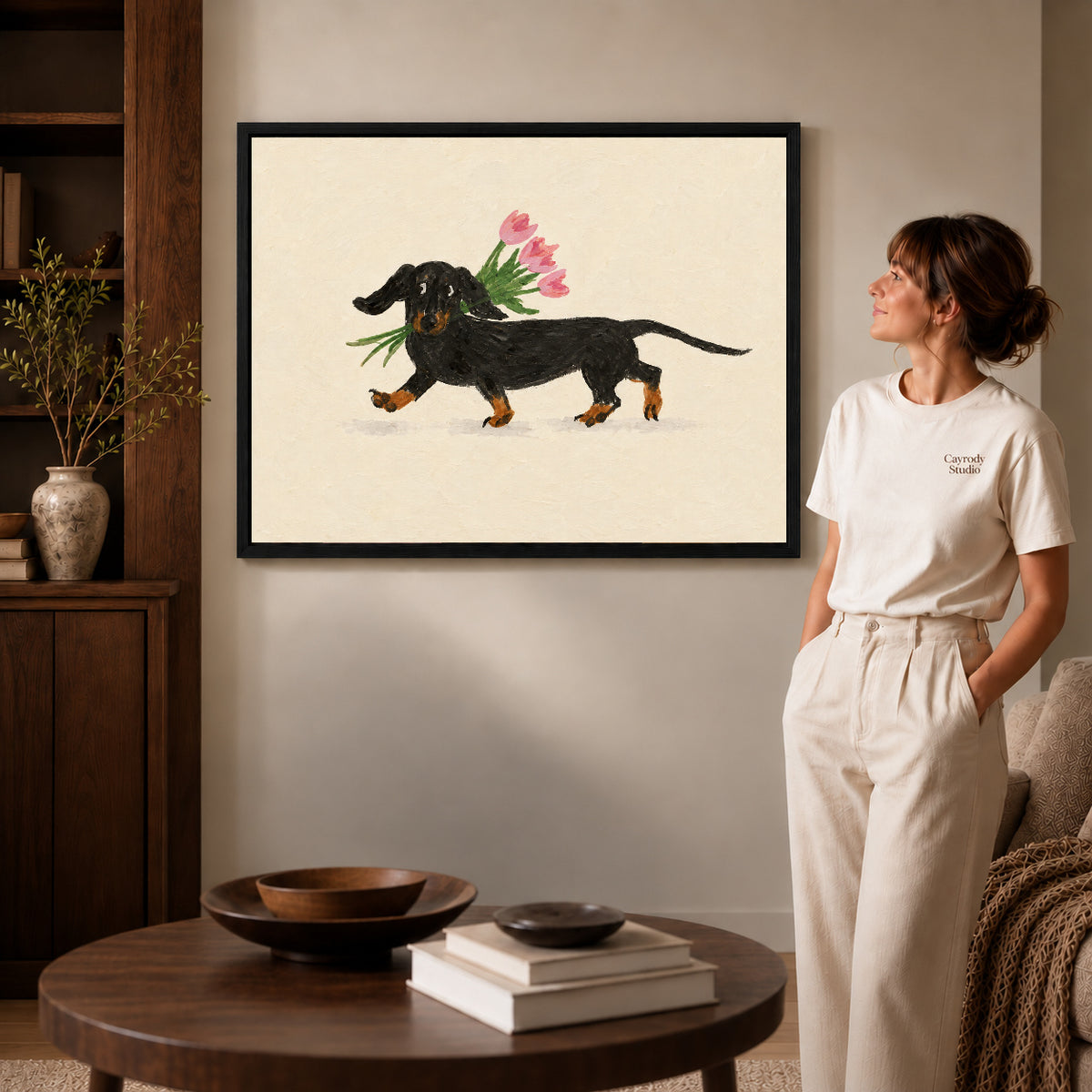 Dachshund tulips canvas art shown in the black frame option against a softly lit wall.