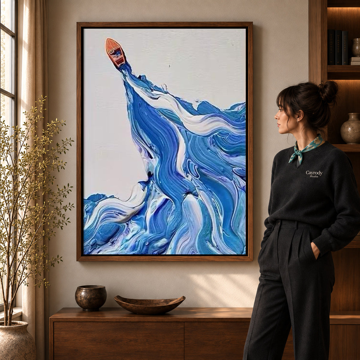 Blue wave canvas art shown in the walnut frame option within a warm living room.