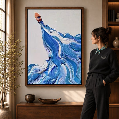 Blue wave canvas art shown in the walnut frame option within a warm living room.