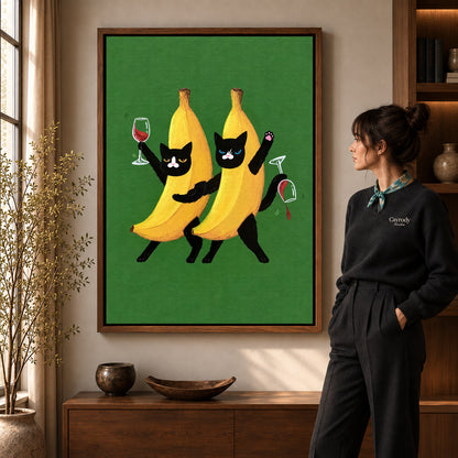 Banana cats canvas art shown in the walnut frame option within a warm living room.