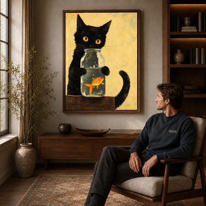 Black cat goldfish canvas art in a walnut frame above a console beside a seated man.