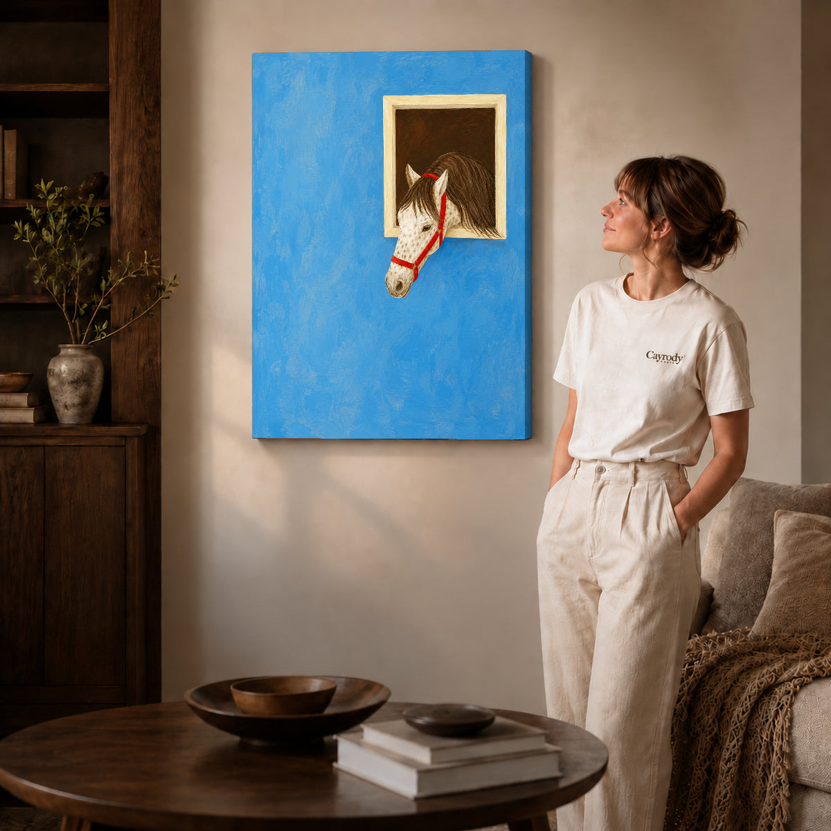 Horse canvas art on gallery-wrapped canvas with natural edge shading beside a standing woman.