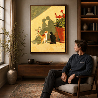Sunlit cats canvas art in a walnut frame above a console beside a seated man.