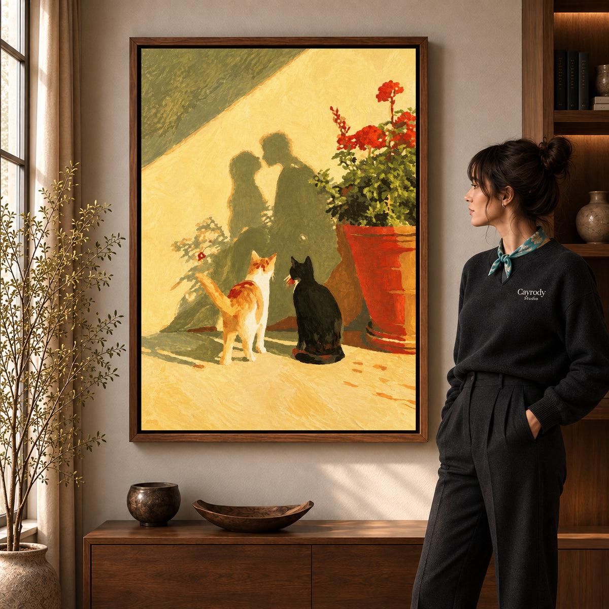 Sunlit cats canvas art shown in the walnut frame option within a warm living room.