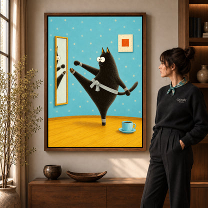 whimsical karate cat canvas art in a walnut frame beside a standing woman and wooden console.