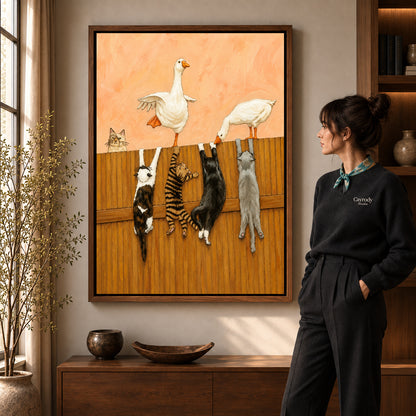 Geese and cats canvas art in a walnut frame beside a standing woman and wooden console.
