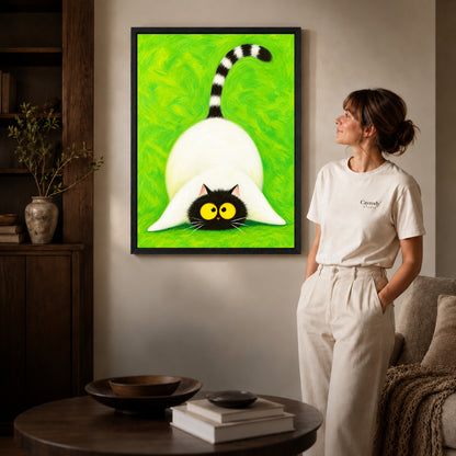 Playful cat canvas art shown in the black frame option against a softly lit wall.
