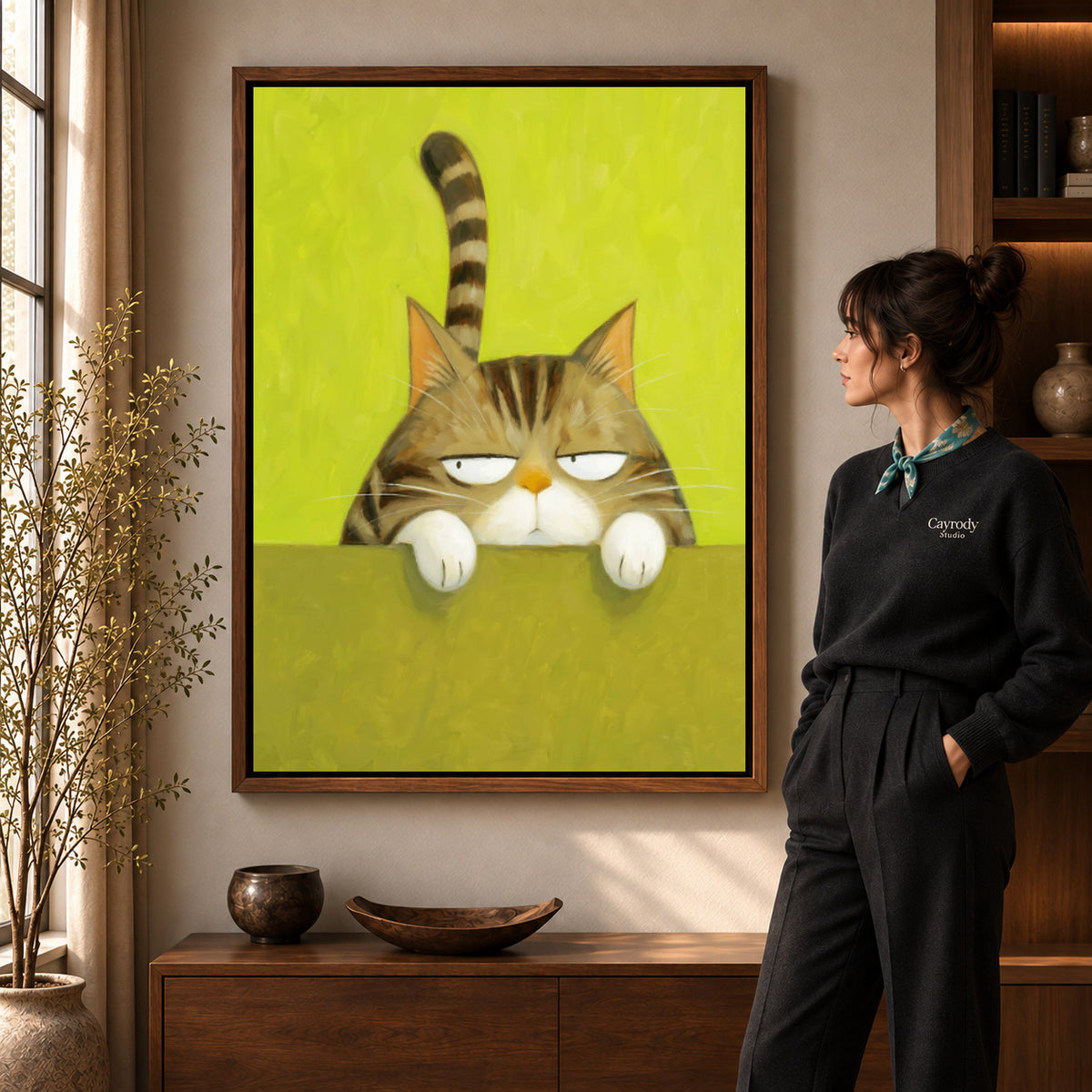Grumpy tabby canvas art shown in the walnut frame option within a warm living room.