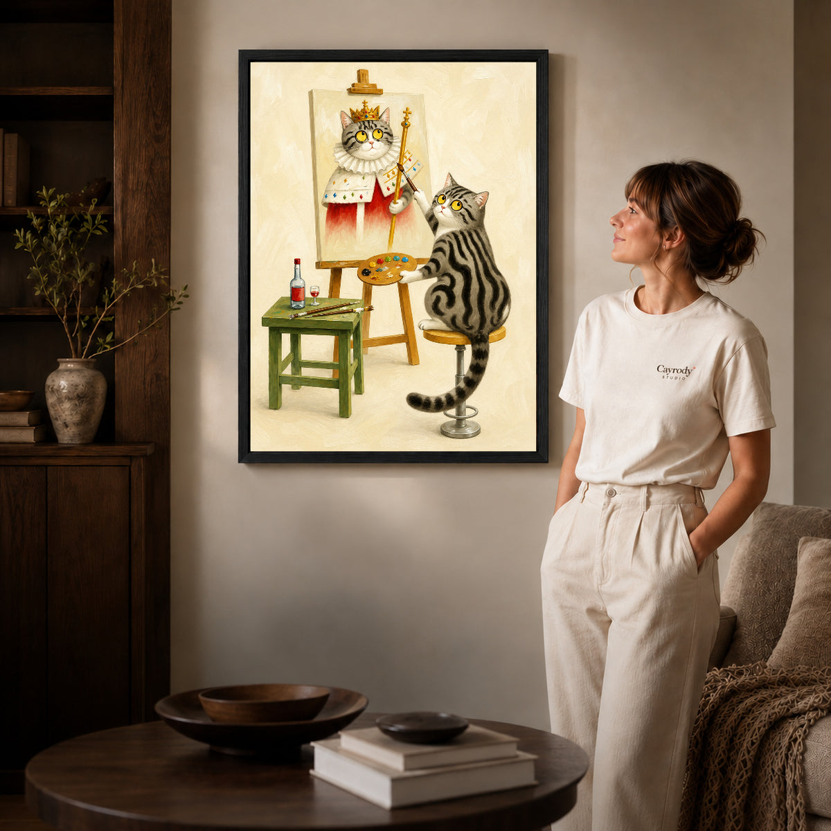 Cat artist canvas art shown in the black frame option against a softly lit wall.
