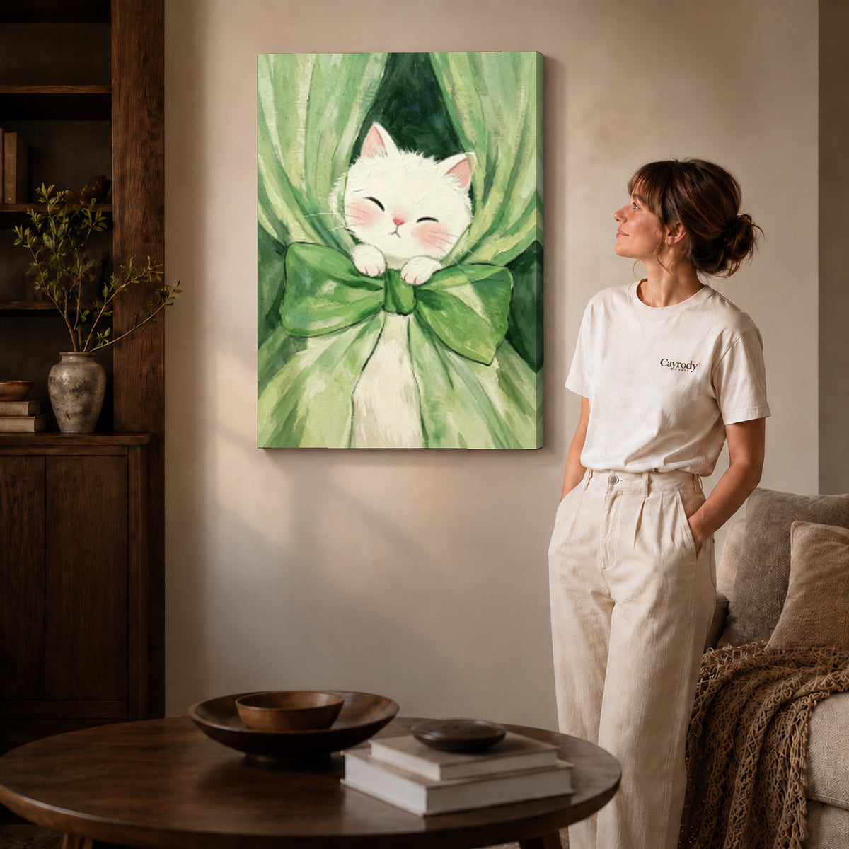 White cat canvas art on gallery-wrapped canvas with natural edge shading beside a standing woman.