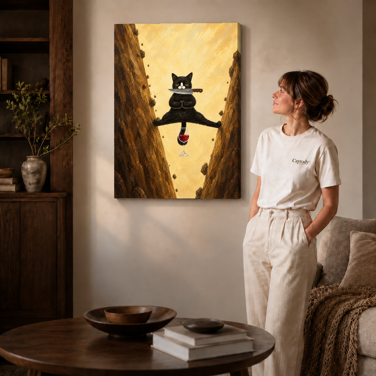 Acrobatic cat canvas art on gallery-wrapped canvas with natural edge shading beside a standing woman.