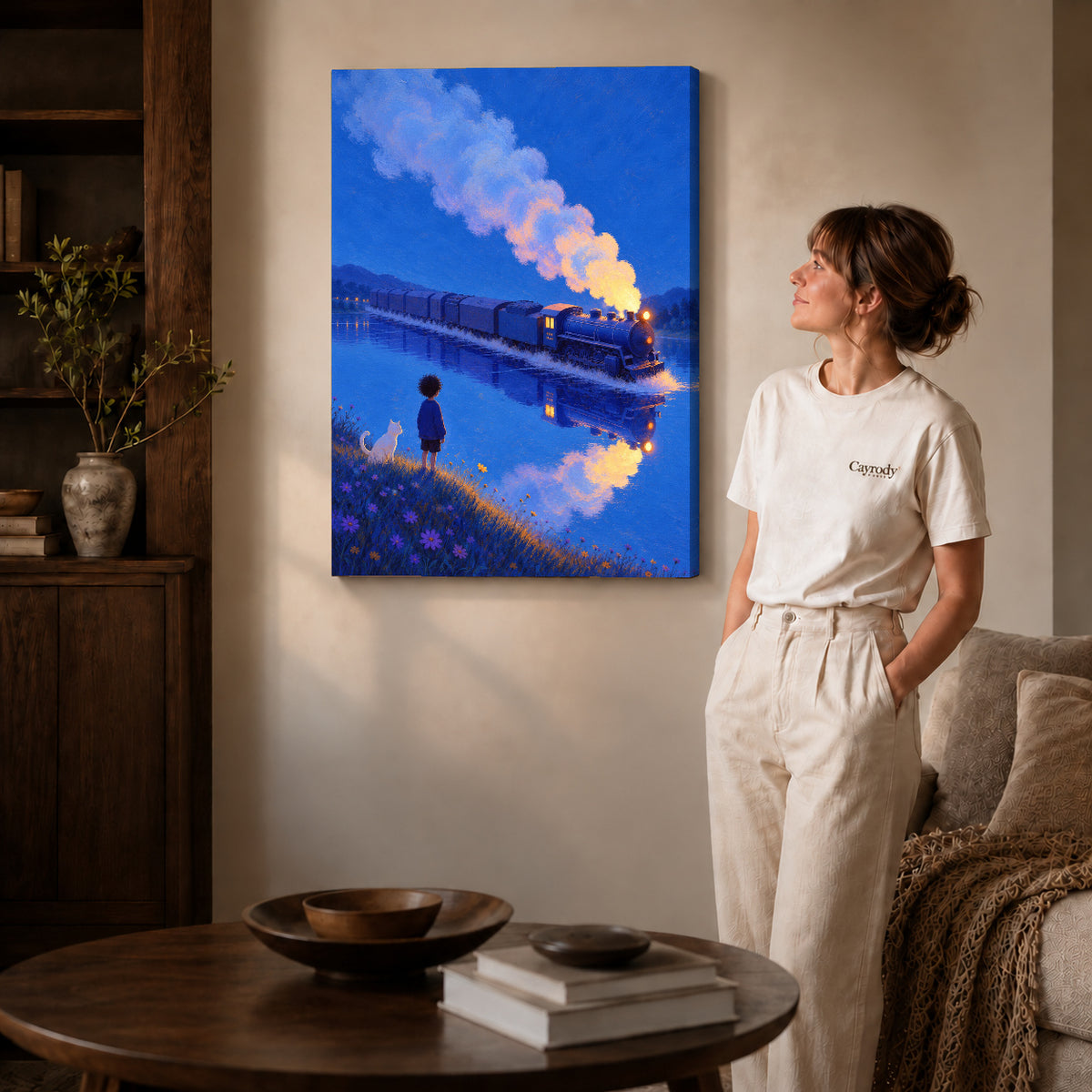 Train lake canvas art on gallery-wrapped canvas with visible depth beside a woman in a warm living room.