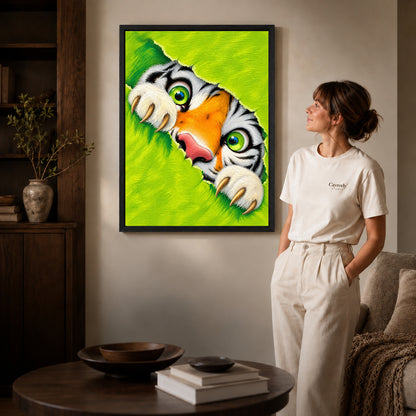 Peeking tiger canvas art shown in the black frame option against a softly lit wall.