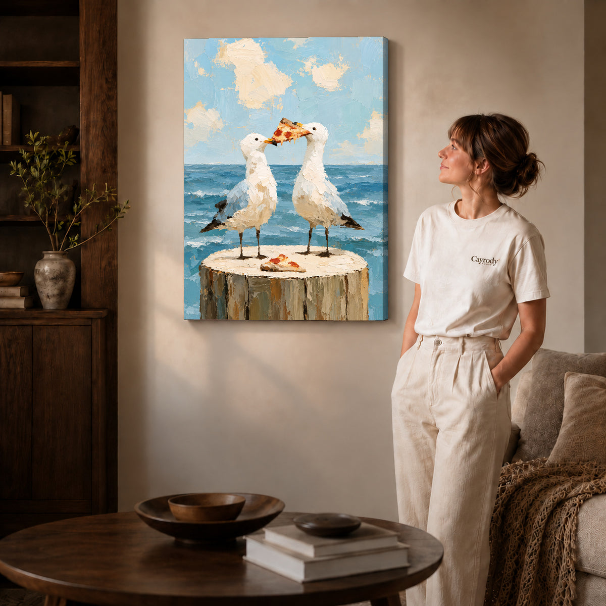 Seagull pizza canvas art on gallery-wrapped canvas with natural edge shading beside a standing woman.