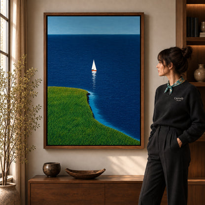 Coastal sailboat canvas art shown in the walnut frame option within a warm living room.