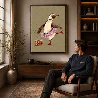 Dancing penguin canvas art in a walnut frame above a console beside a seated man.