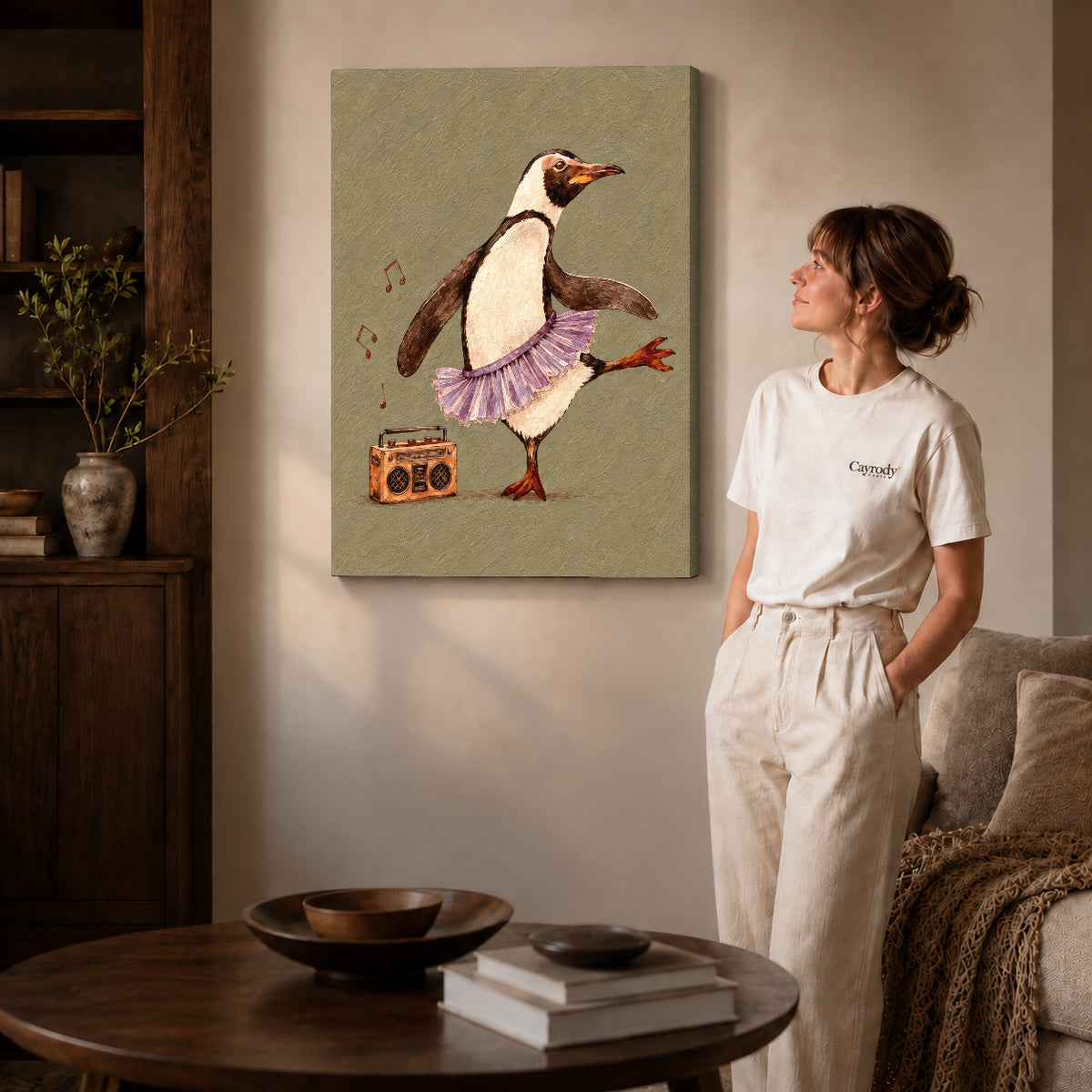 Dancing penguin canvas art shown in the gallery-wrapped option with visible depth and warm surroundings.