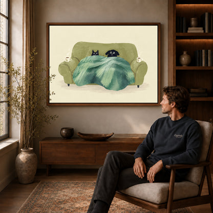 Cozy pets canvas art in a walnut frame above a console beside a seated man.