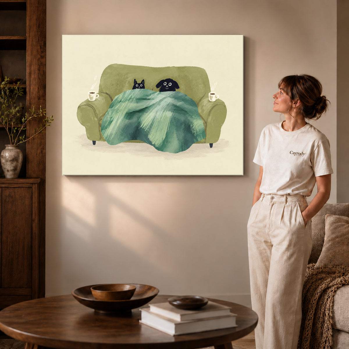 Cozy pets canvas art on gallery-wrapped canvas with natural edge shading beside a standing woman.