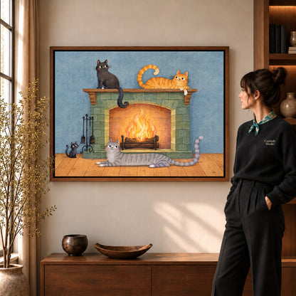 Fireplace cats canvas art shown in the walnut frame option within a warm living room.