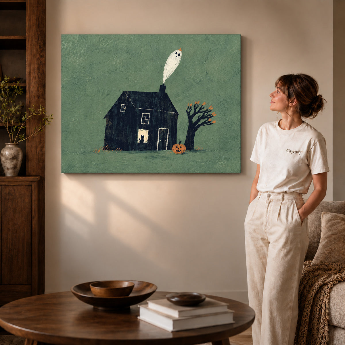 Ghost house canvas art shown in the gallery-wrapped option with visible depth and warm surroundings.