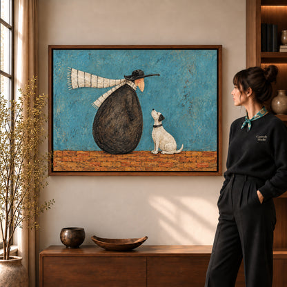 Whimsical companion canvas art in a walnut frame beside a standing woman and wooden console.