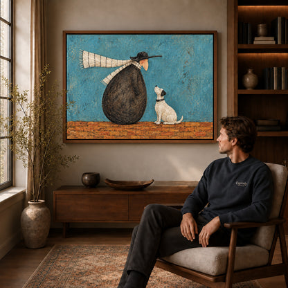 Whimsical companion canvas art in a walnut frame above a console beside a seated man.