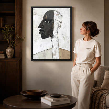 Abstract profile canvas art shown in the black frame option against a softly lit wall.