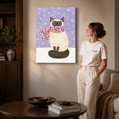 Winter cat canvas art on gallery-wrapped canvas with natural edge shading beside a standing woman.