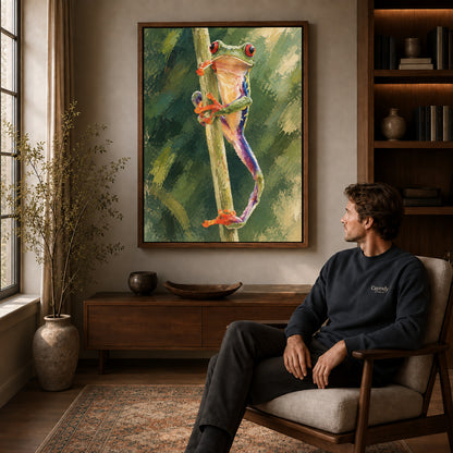Tree frog canvas art in a walnut frame above a console beside a seated man.