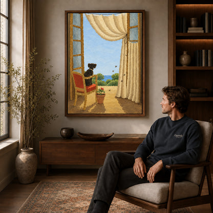 Window dog canvas art in a walnut frame above a console beside a seated man.