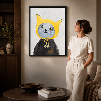 yellow hood cat canvas art shown in the black frame option against a softly lit wall.