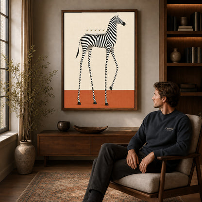 martini tray zebra canvas art in a walnut frame above a console beside a seated man.