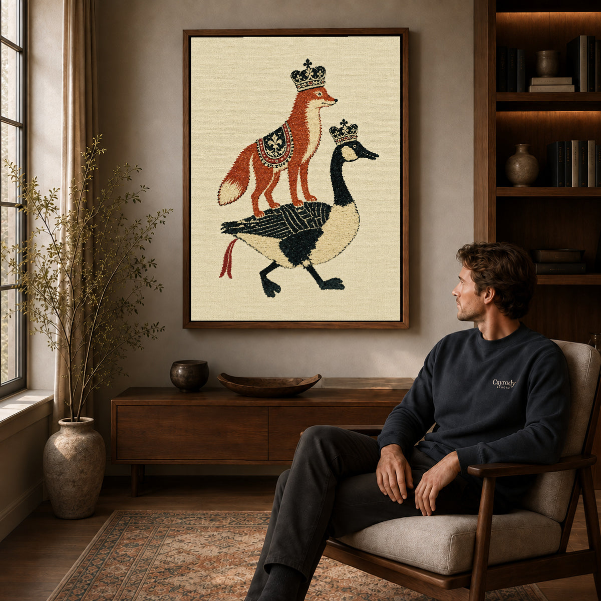 royal fox goose canvas art in a walnut frame above a console beside a seated man.