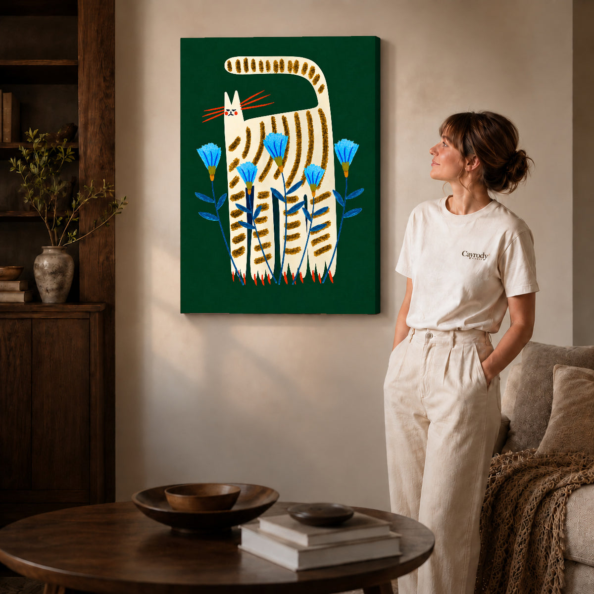striped floral cat canvas art on gallery-wrapped canvas with natural edge shading beside a standing woman.