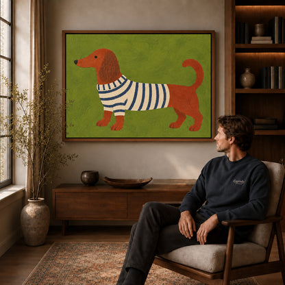 striped sweater dachshund canvas art in a walnut frame above a console beside a seated man.