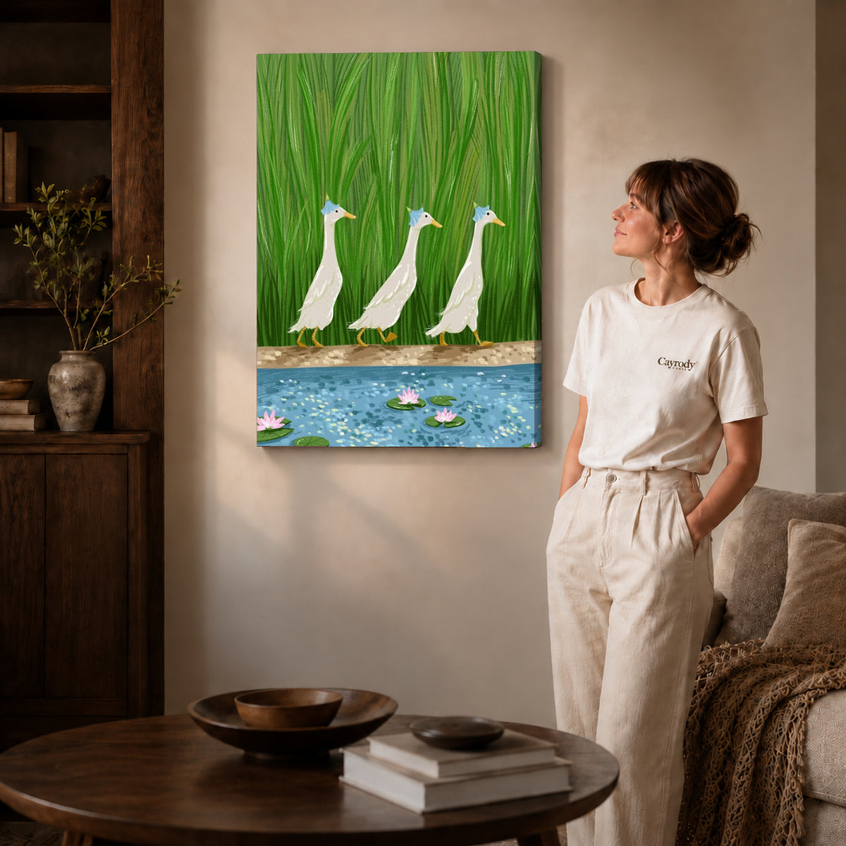 folk pond geese canvas art on gallery-wrapped canvas with natural edge shading beside a standing woman.