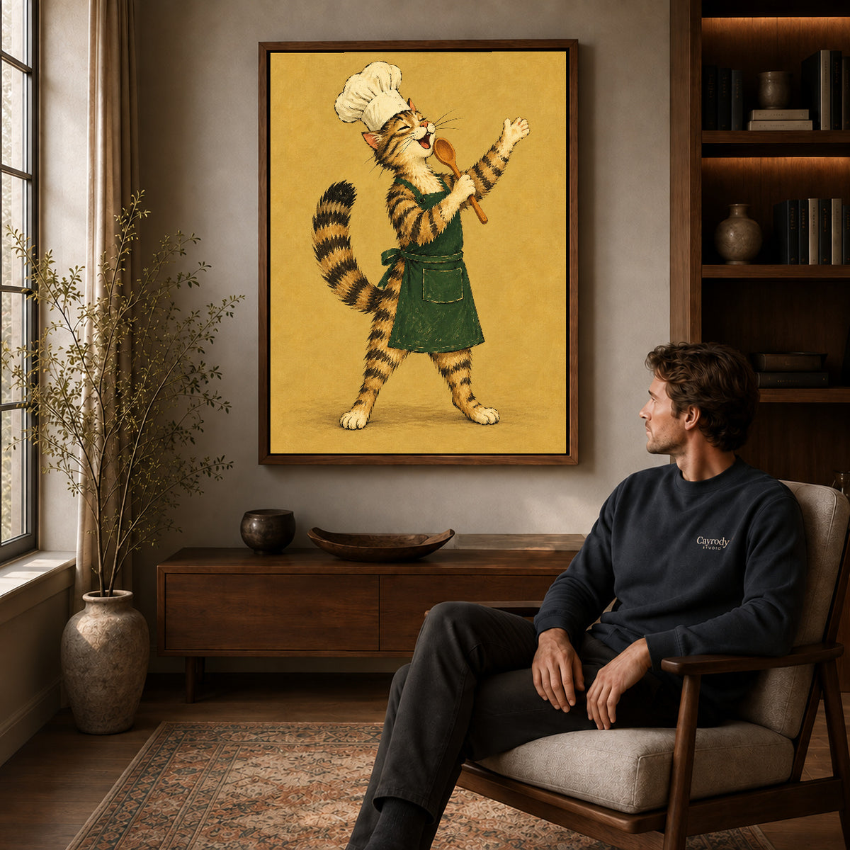 vintage singing chef cat canvas art in a walnut frame above a console beside a seated man.