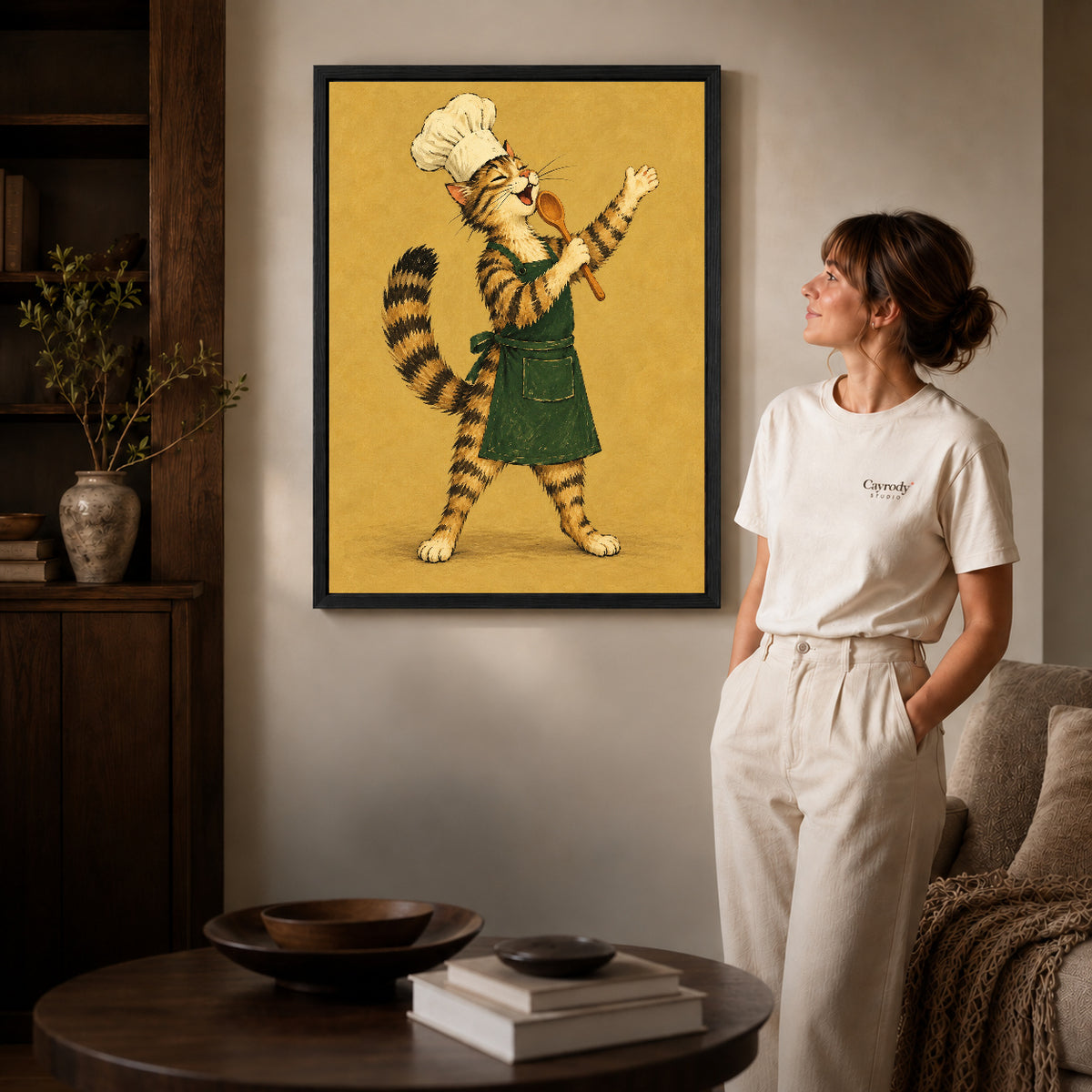 vintage singing chef cat canvas art shown in the black frame option against a softly lit wall.