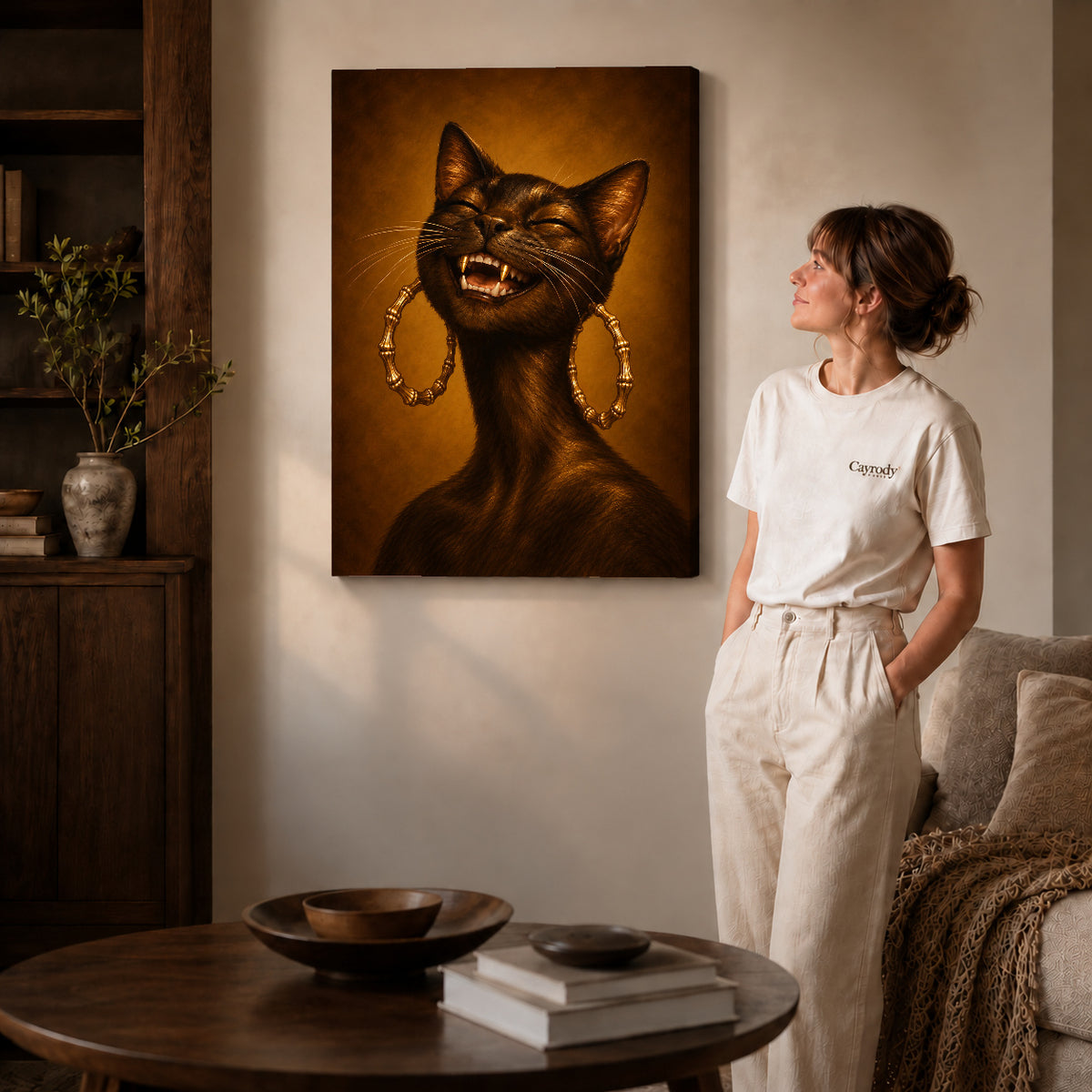 expressive golden cat canvas art on gallery-wrapped canvas with natural edge shading beside a standing woman.