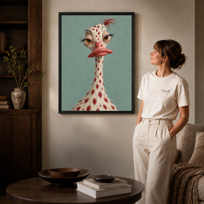 whimsical ostrich portrait canvas art in a black frame beside a woman and round wooden table.