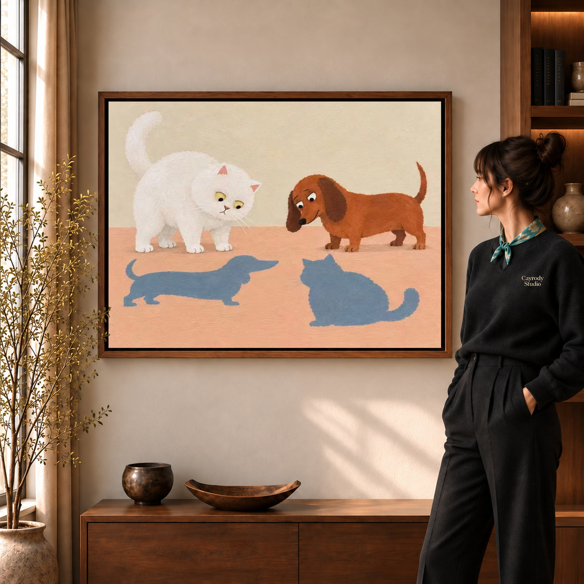 playful swapped shadows canvas art in a walnut frame beside a standing woman and wooden console.