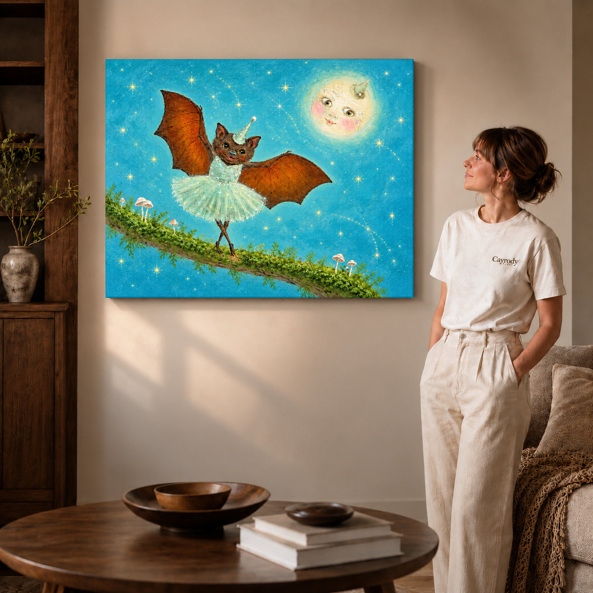 fantasy ballet bat canvas art on gallery-wrapped canvas with visible edge depth beside a standing woman.