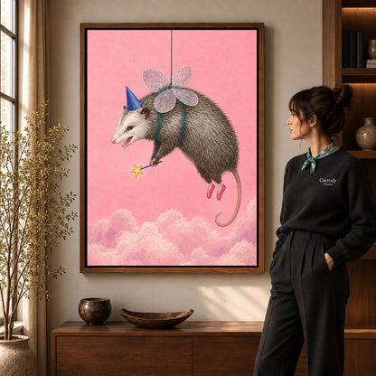 whimsical fairy opossum canvas art in a walnut frame beside a standing woman and wooden console.