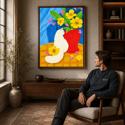 painterly white cat canvas art in a walnut frame above a console beside a seated man.