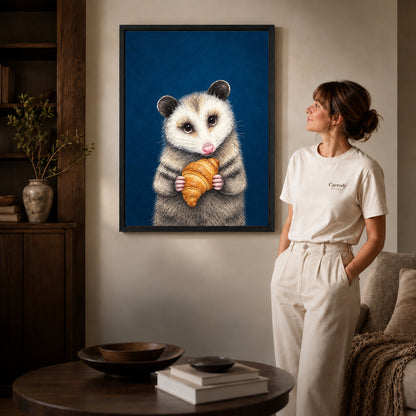 croissant opossum portrait canvas art shown in the black frame option against a softly lit wall.